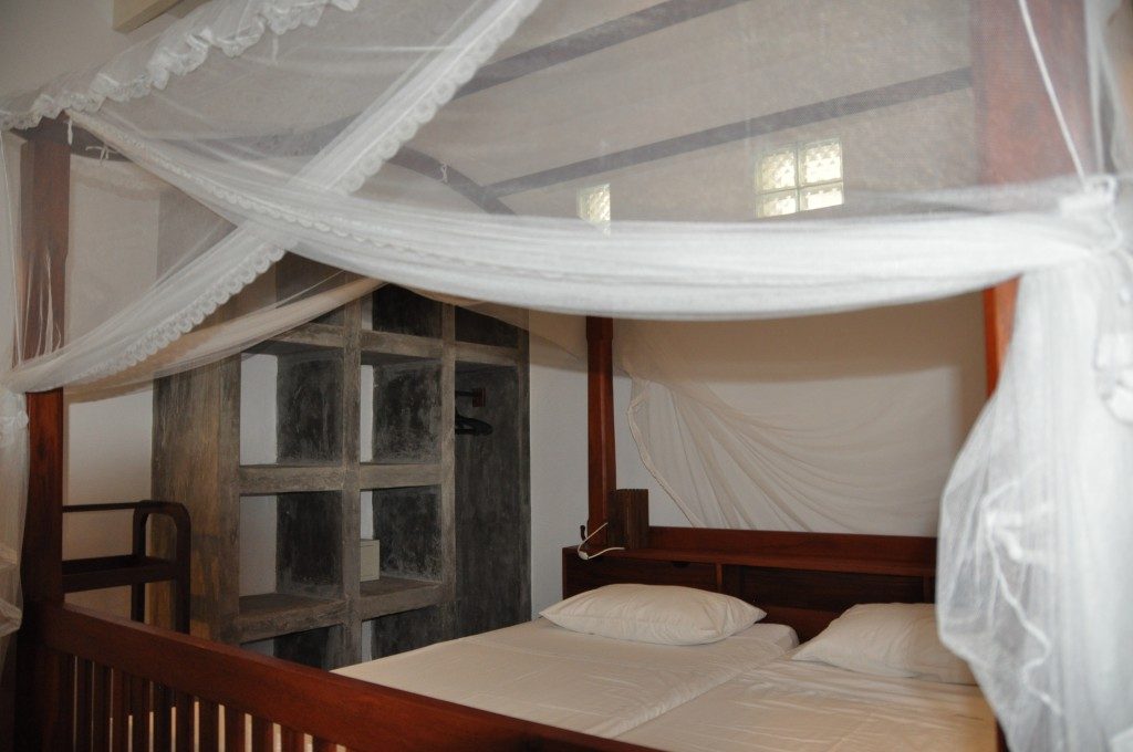 Concrete cubbies in bedroom used as storage space