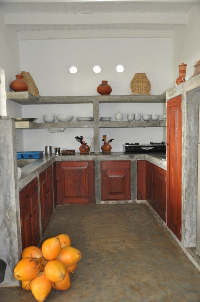 Cement kitchen with open shelving